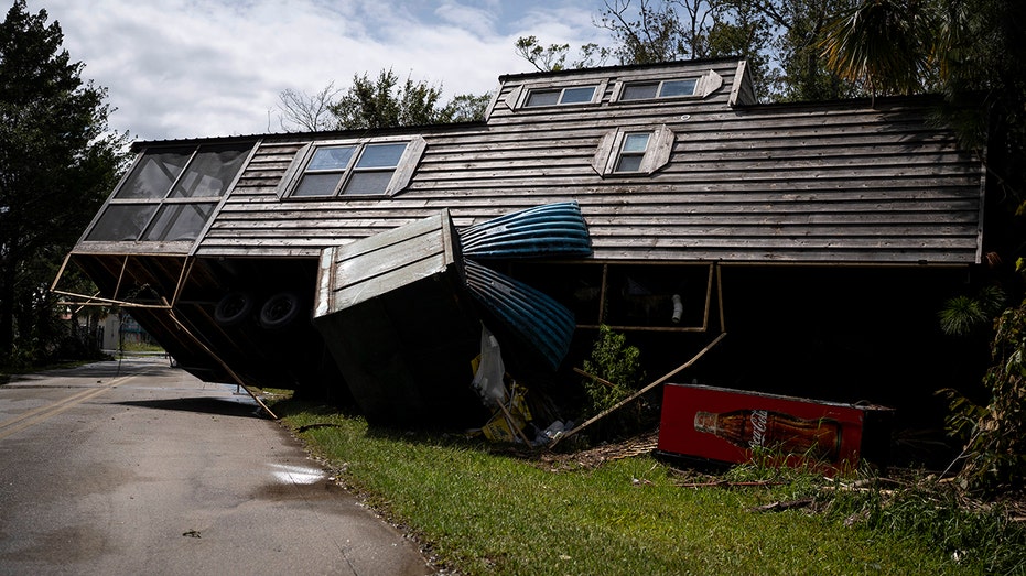 Home pushed onto a road