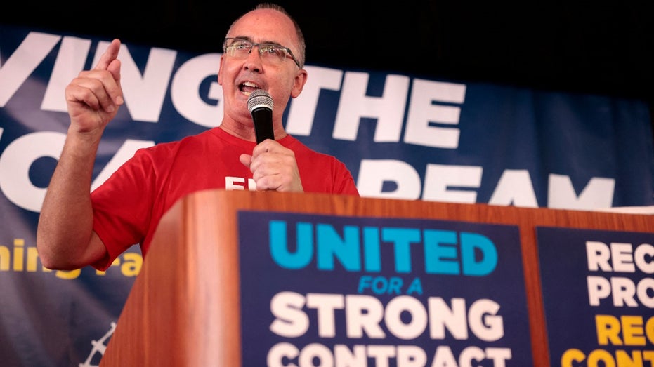 UAW president Shawn Fain speaks at rally